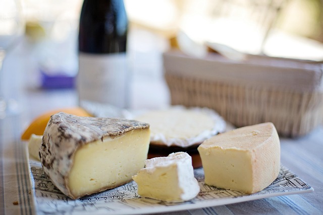 milk bottles and dairy packaging on rustic wooden table